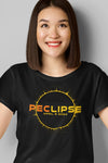 woman wearing a unisex black t-shirt with the PEC eclipse design as a souvenir of the total eclipse of the sun