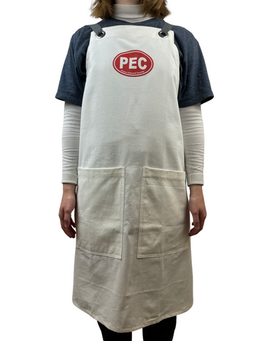 red pec oval on natural cotton canvas apron