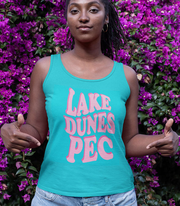 woman wearing turquoise blue tank top with lake dunes pec 80's design in pink 