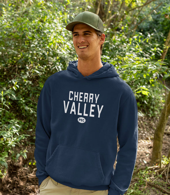 young man wearing navy blue heather hoodie with cherry valley pec