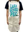 80's font lake dunes pec on cotton apron in blue ink