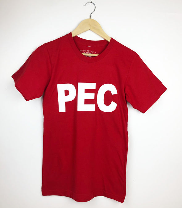 PEC initials in white ink on a red t-shirt 